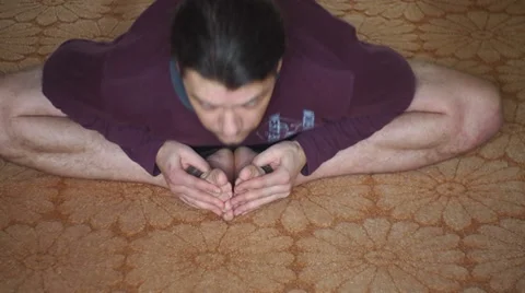 Man doing exercises for flexibility legs and back Stock-Footage 35311820