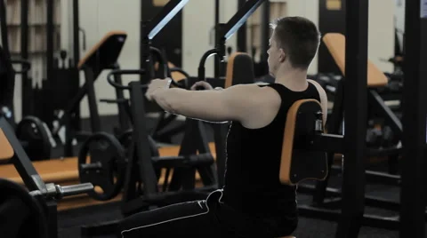 Man doing exercises in the gym Stock Footage 62744699
