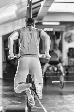 Man doing exercises parallel bars Stock-Fotos