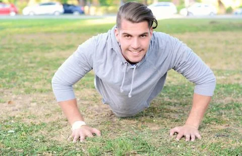 Man doing exercises at park. Stock Photos