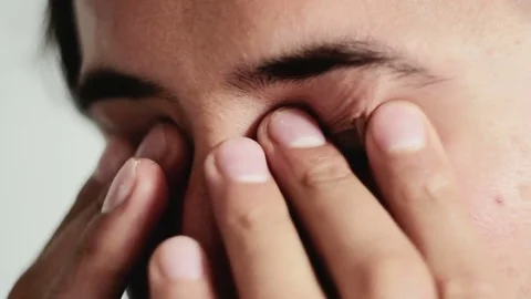 The man is doing an eye massage Stock Footage 75559415