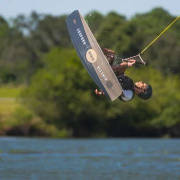 Man doing flip on ronix park board Stock Photos