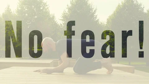 A man doing forearm balance in the park Stock Footage