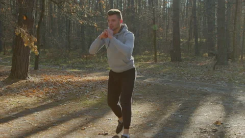 Man Is Doing Forward Lunges with Jumps 스톡 동영상 169155573