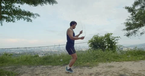 A man doing Freestyle rope skipping - wide angle view Video stock 146094744
