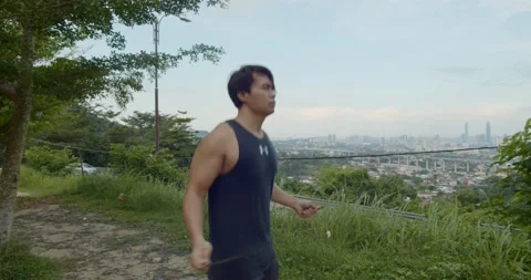 A man doing Freestyle rope skipping - side angle view Stock Footage 146095229