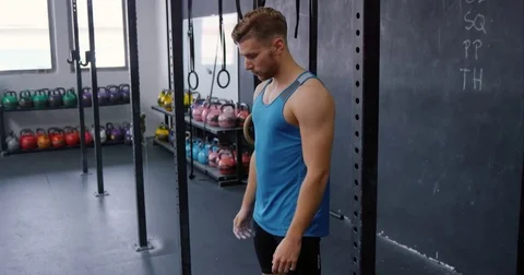 Man Doing Frontal Pull-Ups On Iron Bar Stock Footage 75038686