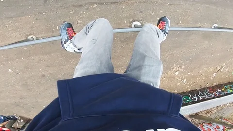 Man doing grind trick on rail on aggressive skates at the skatepark Stock Footage 122511451