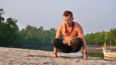 Man doing handstand in lotus position Stock Footage 263537060