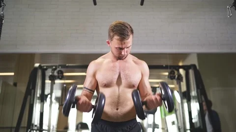 Man doing heavy weight exercise for biceps Stock Footage 138318107