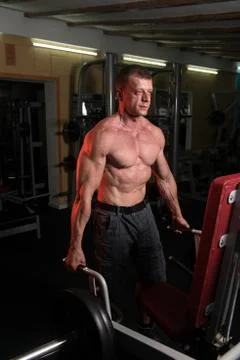 Man Doing Heavy Weight Exercise For Back Stock Photos