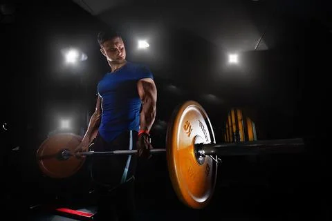 Man Doing Heavy Weight Exercise For Back. Pain and Gain, creative photo, sexy Stock Photos