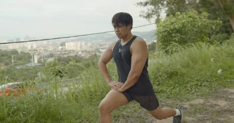 A man doing Hip flexor stretch - wide shoot Stock Footage 146096205