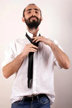 Man doing his tie Stock Photos