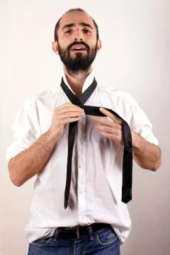 Man doing his tie Stock Photos