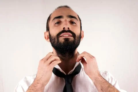 Man doing his tie Stock Photos