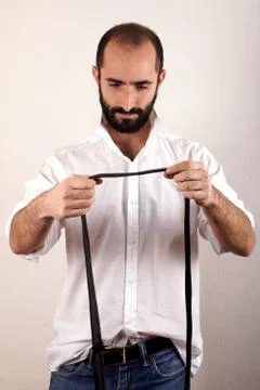 Man doing his tie Stock Photos