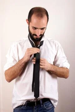 Man doing his tie Stock Photos