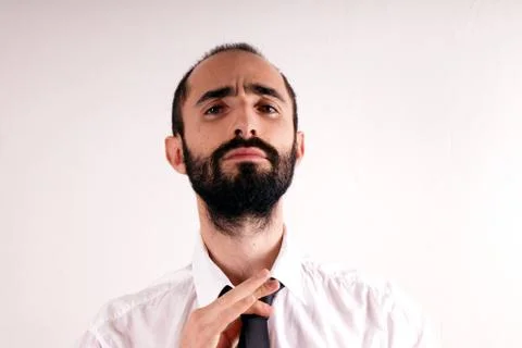 Man doing his tie Stock Photos