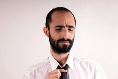 Man doing his tie Stock Photos