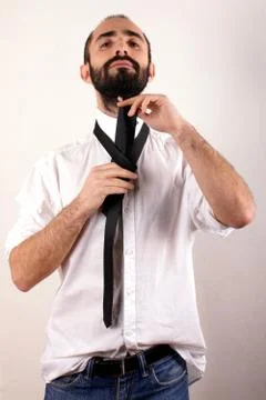 Man doing his tie Stock Photos