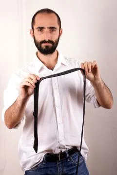 Man doing his tie Stock Photos