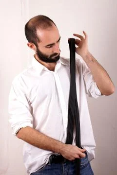 Man doing his tie Stock Photos