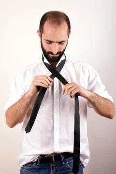 Man doing his tie Stock Photos