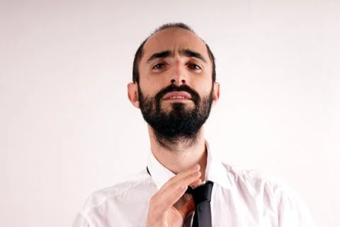 Man doing his tie Stock Photos