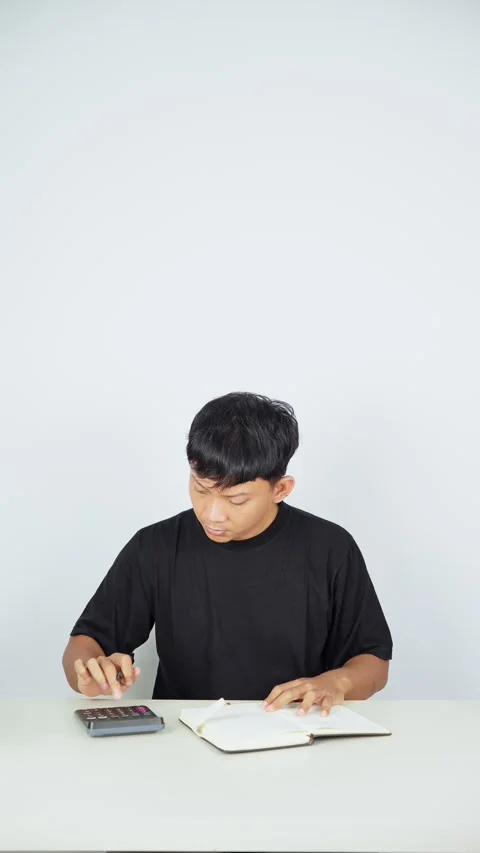 Man Doing Homework With Calculator on White Background Video stock 347105271