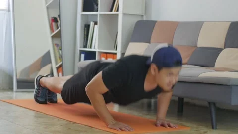 Man doing indoor home workout concept, push ups Stock Footage 140120609