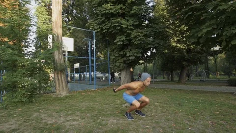 Man doing intense workout outdoors Stock Footage 121834492