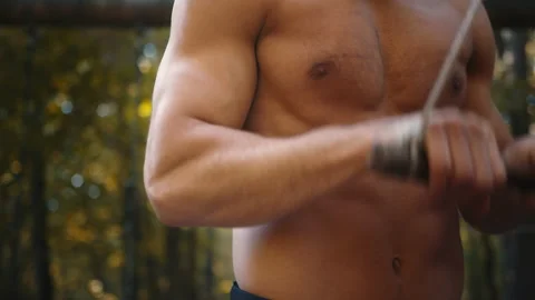 Man doing isolated triceps extension exercise with cable rope. Stock Footage 165048118