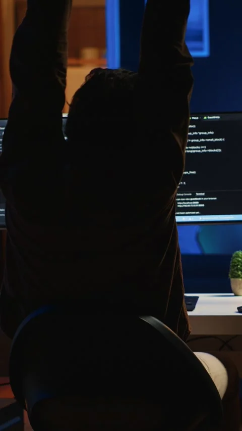Man doing IT support job from home office, stretching after sitting at desk Stock Footage 264508920