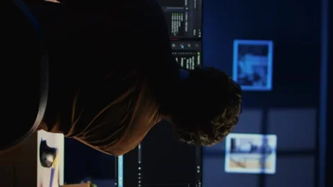 Man doing IT support job from home office, stretching after sitting at desk 스톡 동영상 265109603