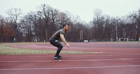 Man doing Jumping Exercises outdoor Stock Footage 145347601