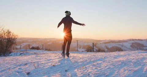 Man doing jumping jacks outdoors in winter Stock Photos