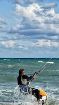 Man doing kitesurf practice Stock Photos