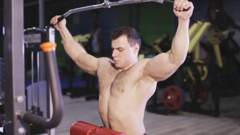 Man doing lat pulldown exercise Stock Footage 80983726