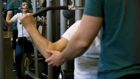 Man Doing Lat Pulldowns in Gym Stock Footage 91769719