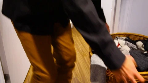Man doing laundry Stock Footage 100694925
