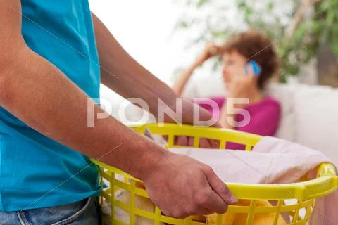 Man doing laundry Stock Photos