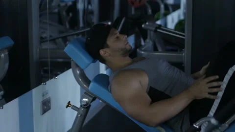 Man is doing leg press Stock Footage 85616613