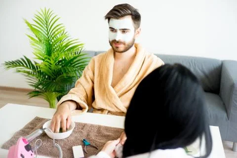 Man doing manicure Stock Photos