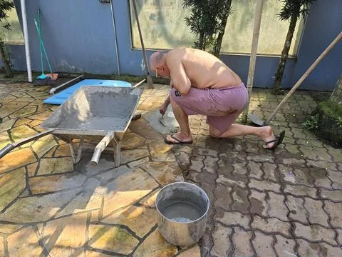 Man doing masonry work Stock Photos