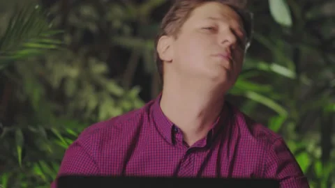 Man doing neck exercises while sitting at the computer Stock Footage 150168608