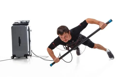 Man doing one hand plank with EMS Stock Photos
