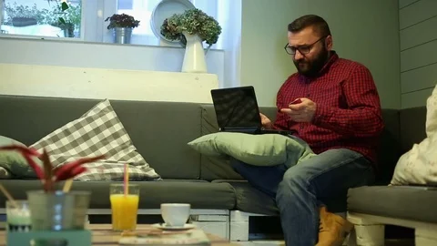 Man doing online shopping in cafe  Stock Footage 70859370