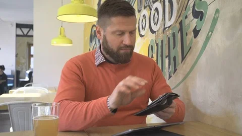 Man doing online shopping by tablet computer, credit card, portrait, steadicam Vidéo 73266082