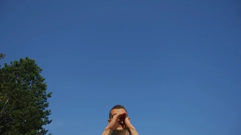 Man doing outdoor box jumps Stock Footage 100031639